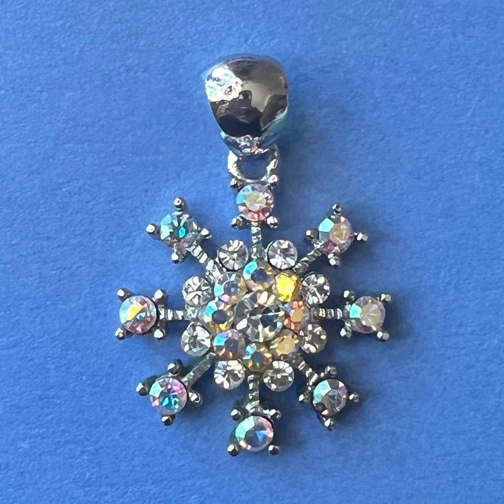 Excellent condition pre-owned Snowflake Pendant with iridescent rhinestones